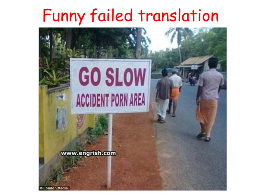 It should be translated as "SLOW DOWN! Accident zone" or "SLOW DOWN! Accident-prone zone"